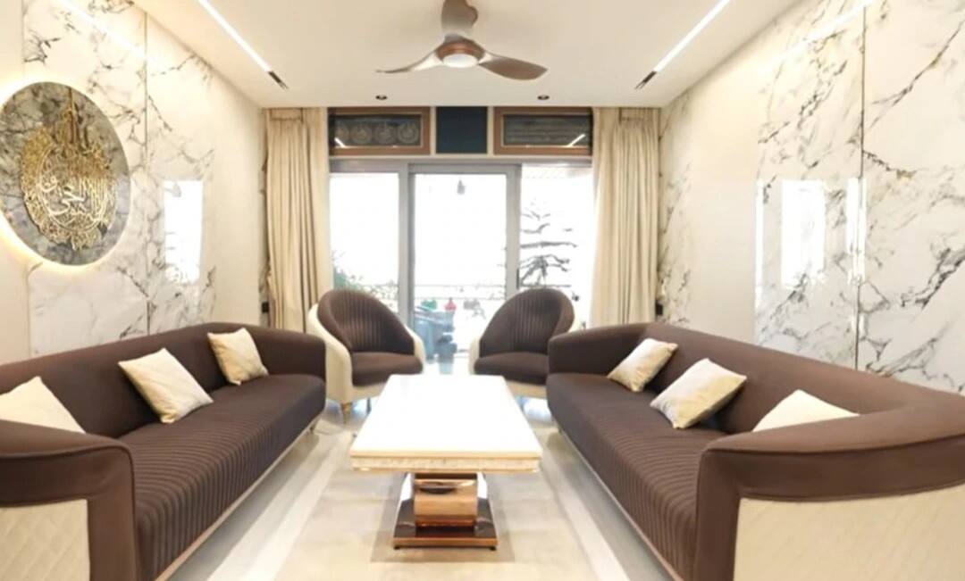 The most special part of Mr. Faizu's house is his spacious living area. Which has modern sofa, stylish lighting and setup for video shoot.