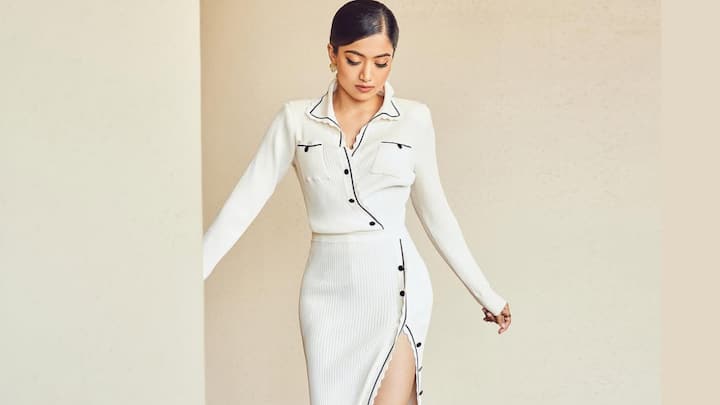 Rashmika Mandanna nails modern minimalism in this ribbed ivory co-ord set with a fitted top and sleek slit skirt. A low bun, statement earrings, and black heels keep the look polished yet contemporary. (Image Source: Instagram/ rashmika_mandanna)