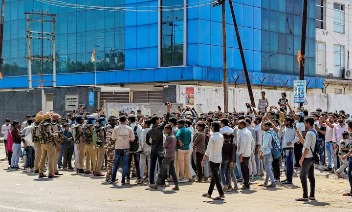 Factory workers during a protest demanding a hike in wages, in Noida, Gautam Buddh Nagar district, Uttar Pradesh.