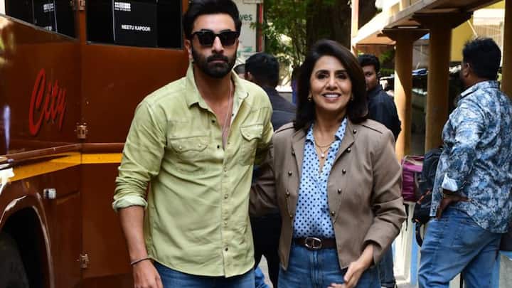 Neetu Kapoor exudes graceful ease in a soft blue top layered with a beige jacket and a long denim skirt. Minimal styling and her radiant presence make the look feel elegant yet approachable.