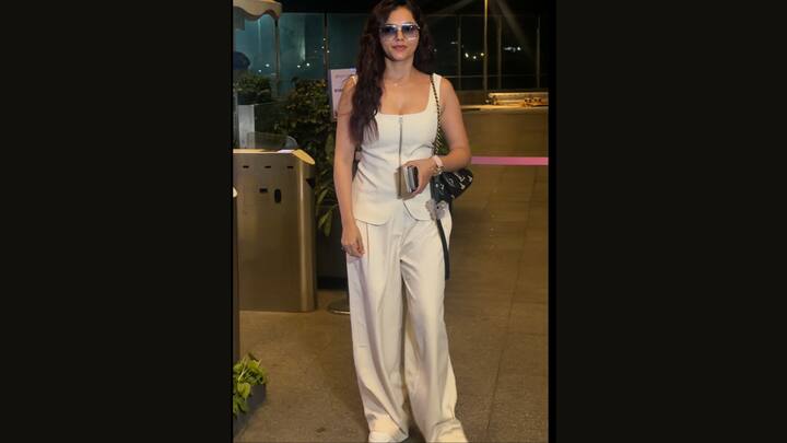 Rubina Dilaik exuded modern glamour in sophisticated monochrome ensemble that perfectly balanced elegance and power dressing. She wore a structured sleeveless top with wide-leg trousers, while oversized tinted sunglasses and a stylish shoulder bag elevated the outfit further. Her softly styled waves added a graceful touch to the sharp silhouette.