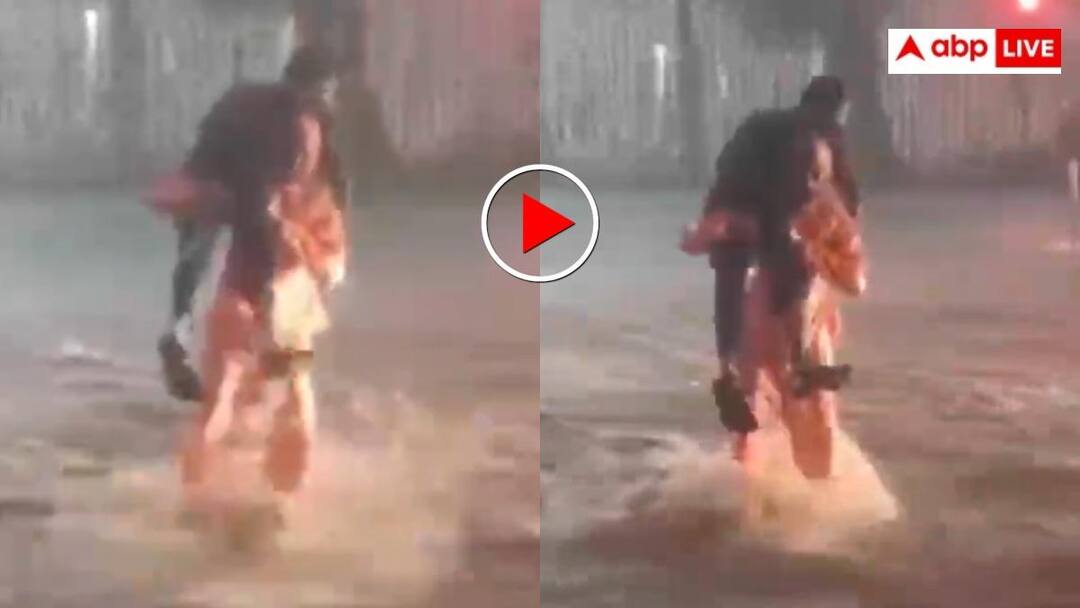 बारिश में इंसानियत की जीत! ट्रैफिक पुलिस ने कंधे पर उठाकर दिव्यांग युवक को पार कराया रास्ता