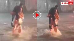 बारिश में इंसानियत की जीत! ट्रैफिक पुलिस ने कंधे पर उठाकर दिव्यांग युवक को पार कराया रास्ता