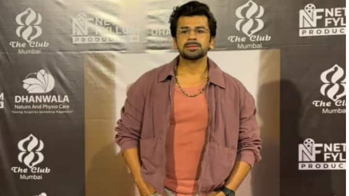 Samarth Jurel styled in casual layered clothing in the party.