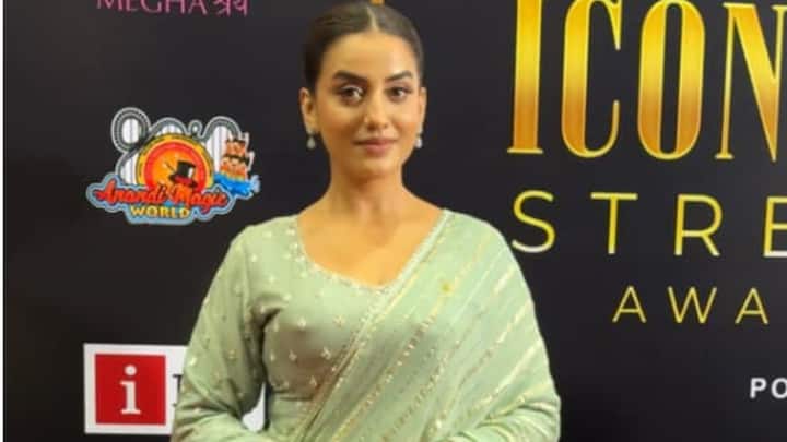 Akshara Singh attended the award ceremony in a light green sharara set with gold embroidery.