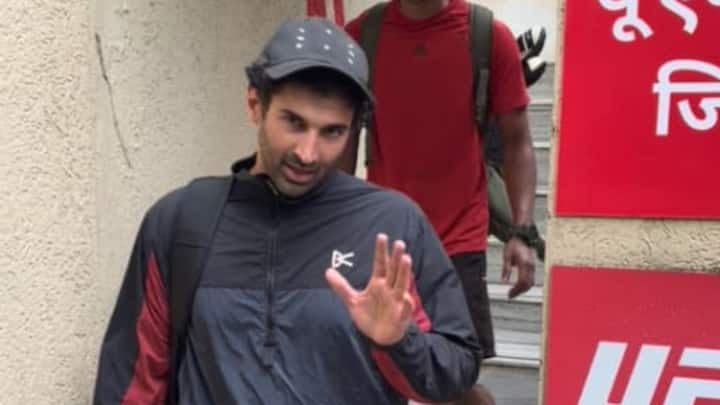 Aditya Roy Kapur was seen stepping out of the UFC Gym after what appeared to be an intense workout session. Keeping it casual and sporty, the Aashiqui 2 star acknowledged the paparazzi with a friendly wave and a thumbs-up, flashing his signature charm despite the rainy weather. (Image Source: ABP Live)