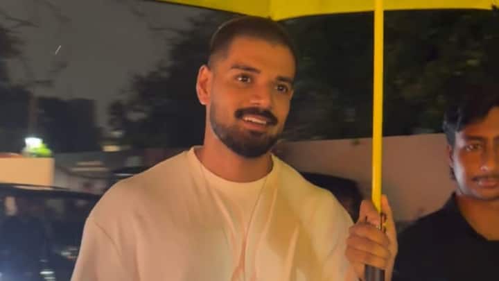 Sooraj Pancholi Spotted At in Juhu, He is wearing a plain white oversized crewneck t-shirt paired with grey cargo pants.