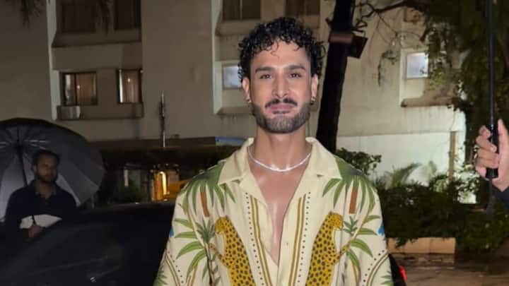 Umar Riaz spotted in Mumbai, wearing a notable H&M relaxed fit printed resort shirt with tan or caramel-colored straight-leg trousers