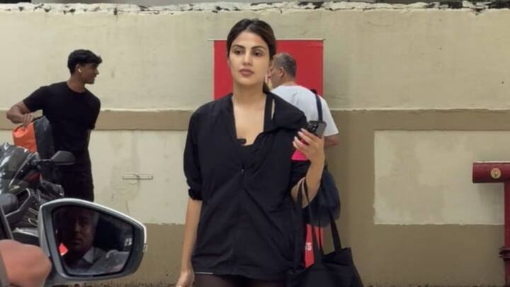 Rhea Chakraborty spotted leaving a gym in Mumbai wearing a simple black athletic top and dark leggings.