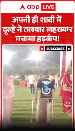 Groom causes a stir by brandishing a sword at his own wedding.