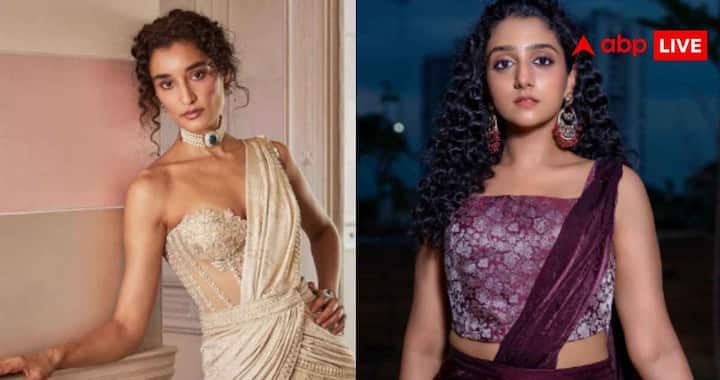 Raksha Bandhan Blouse Designs 2026: रक्षाबंधन पर पहनने के लिए सिलवाएं ये पांच डिजाइनर ब्लाउज, परिवार में अलग ही दिखेगी आपकी चमक 4 कोर्सेट स्टाइल ब्लाउज बॉडी फिट डिजाइन के कारण अट्रैक्टिव लुक देता है और नेट, सीक्वेंस सैटिन साड़ियों के साथ अच्छी तरह मैच करता है. केप स्टाइल ब्लाउज में कंधों से जुड़ा ट्रांसपेरेंट फैब्रिक इसे अलग और एलिगेंट बनाता है, जबकि मिरर वर्क ब्लाउज में लगे छोटे-छोटे शीशे सिंपल साड़ी को भी फेस्टिव और अट्रैक्टिव लुक देने का काम करते हैं.