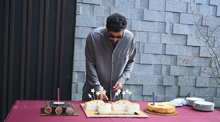 Ranbir Kapoor turned 44 on September 28 and celebrated his birthday with fans and paparazzi outside his Mumbai home. The actor stepped out to greet photographers and fans before cutting a cake. (Image Source: ABP Live)