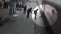 Woman falls on railway track while boarding, rescued by RPF | CCTV Footage